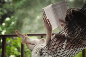 woman reading in hammock